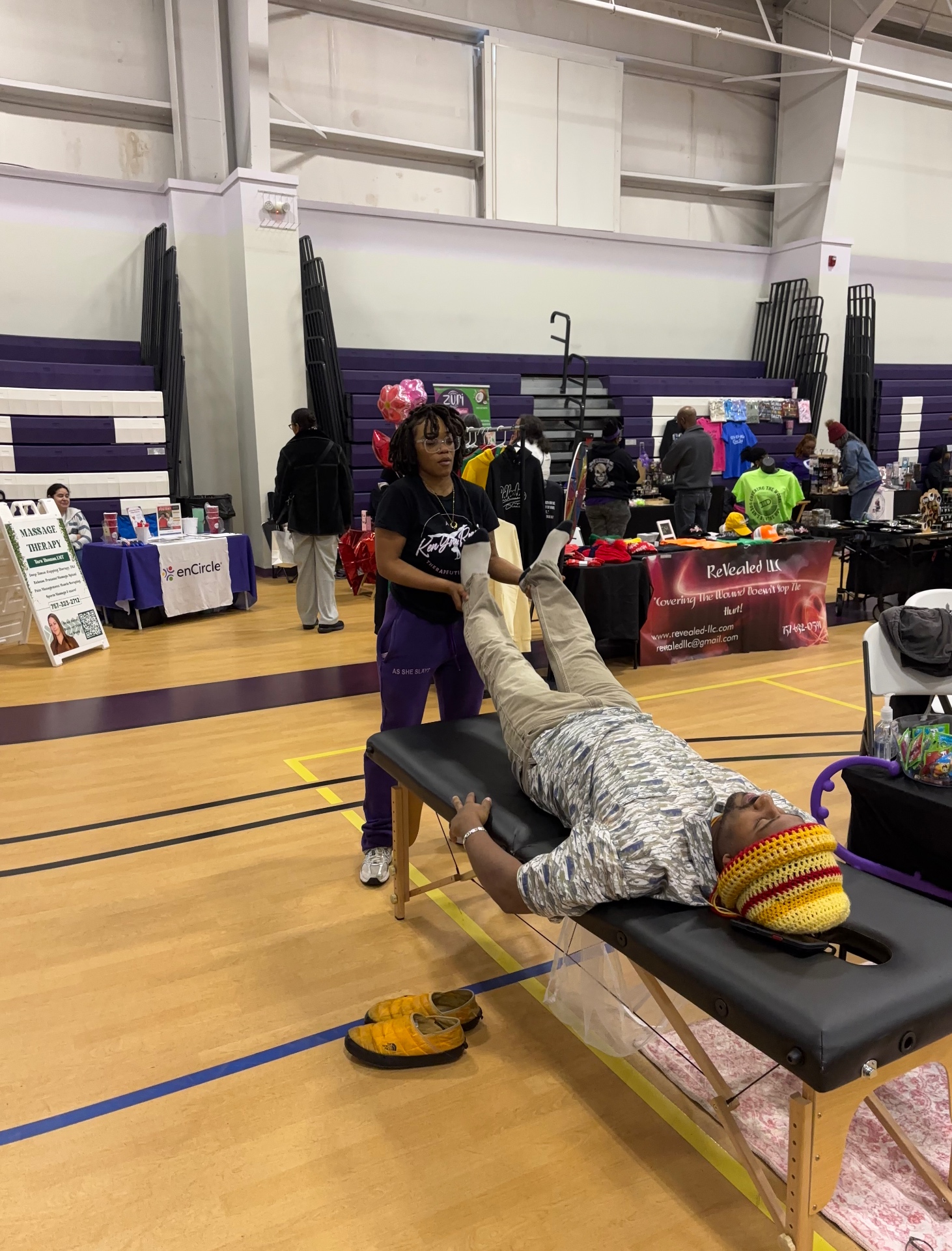 Massage therapist providing bodywork at a past expo
