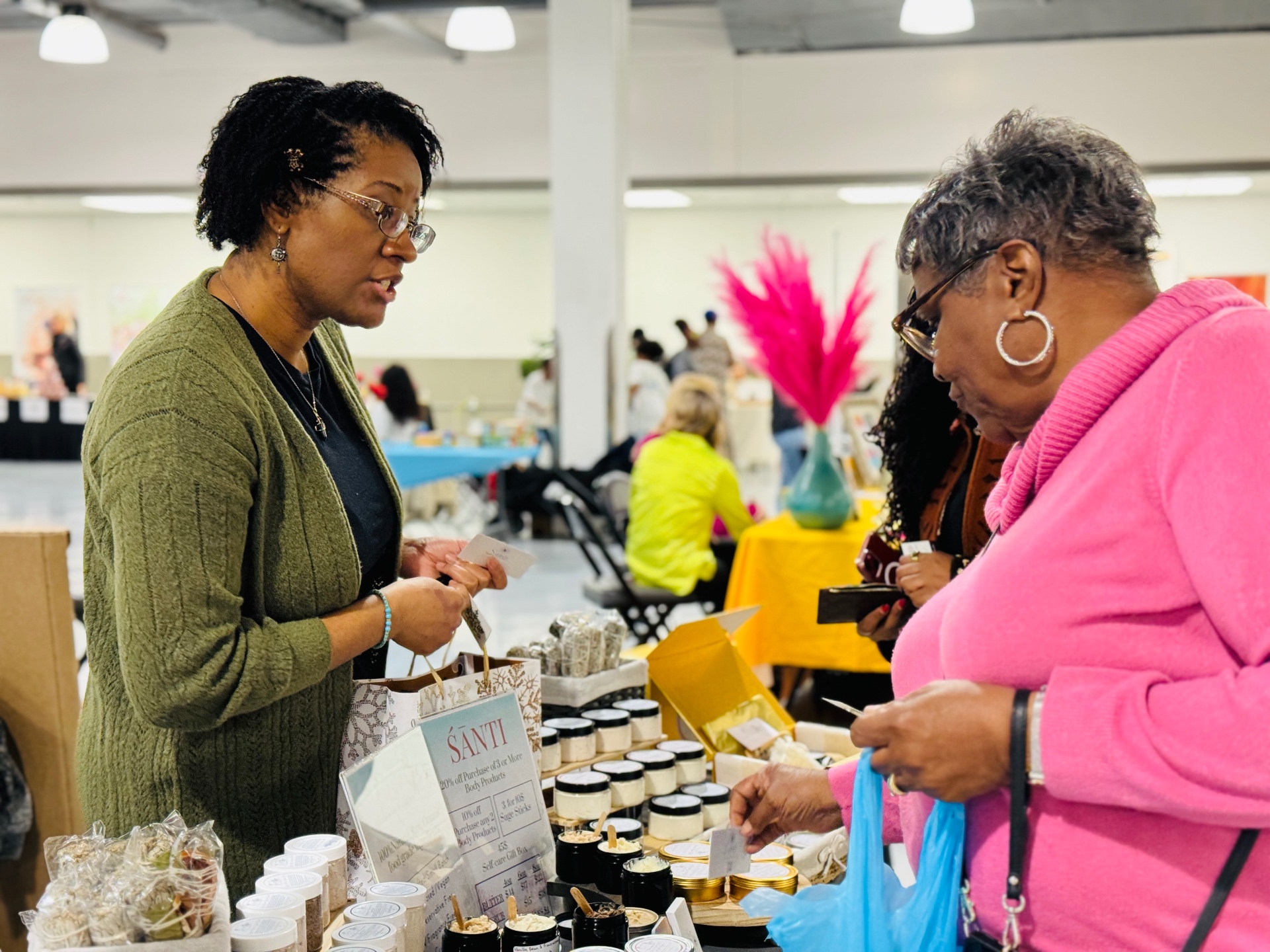 Attendees browsing handmade body care products