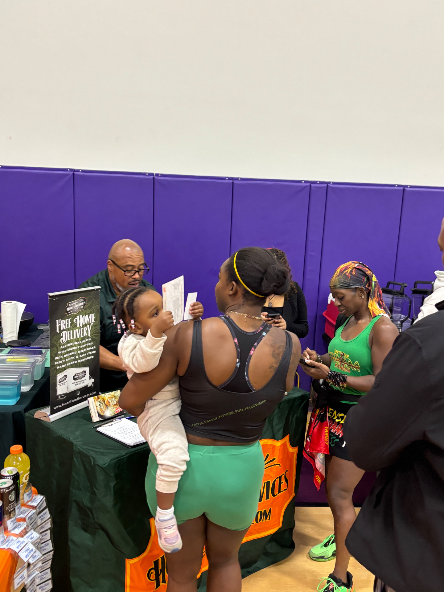 Attendees learning about home food delivery services